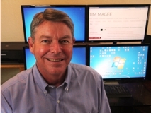 Tim Magee in front of his computer monitor.