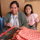 Mother and daughter sewing in Guatemala.
